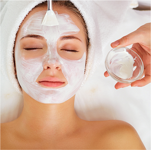 Young Woman with her eyes closed receiving a facial