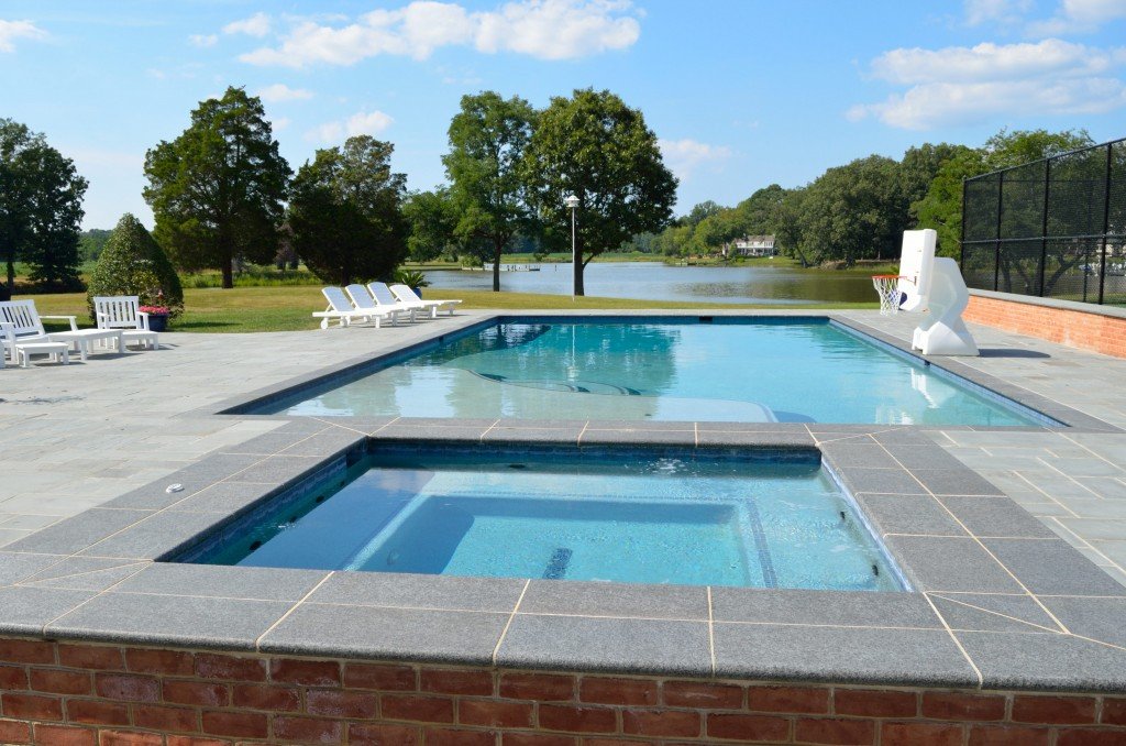 Here the a square spa is raised above the poo level