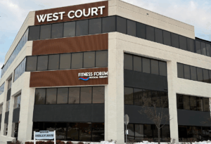 a building with a sign that says west court