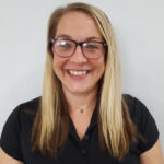 Headshot of a young adult female in black shirt