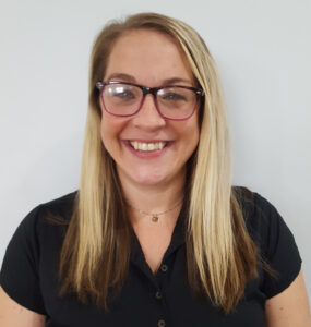 Headshot of a young adult female in black shirt