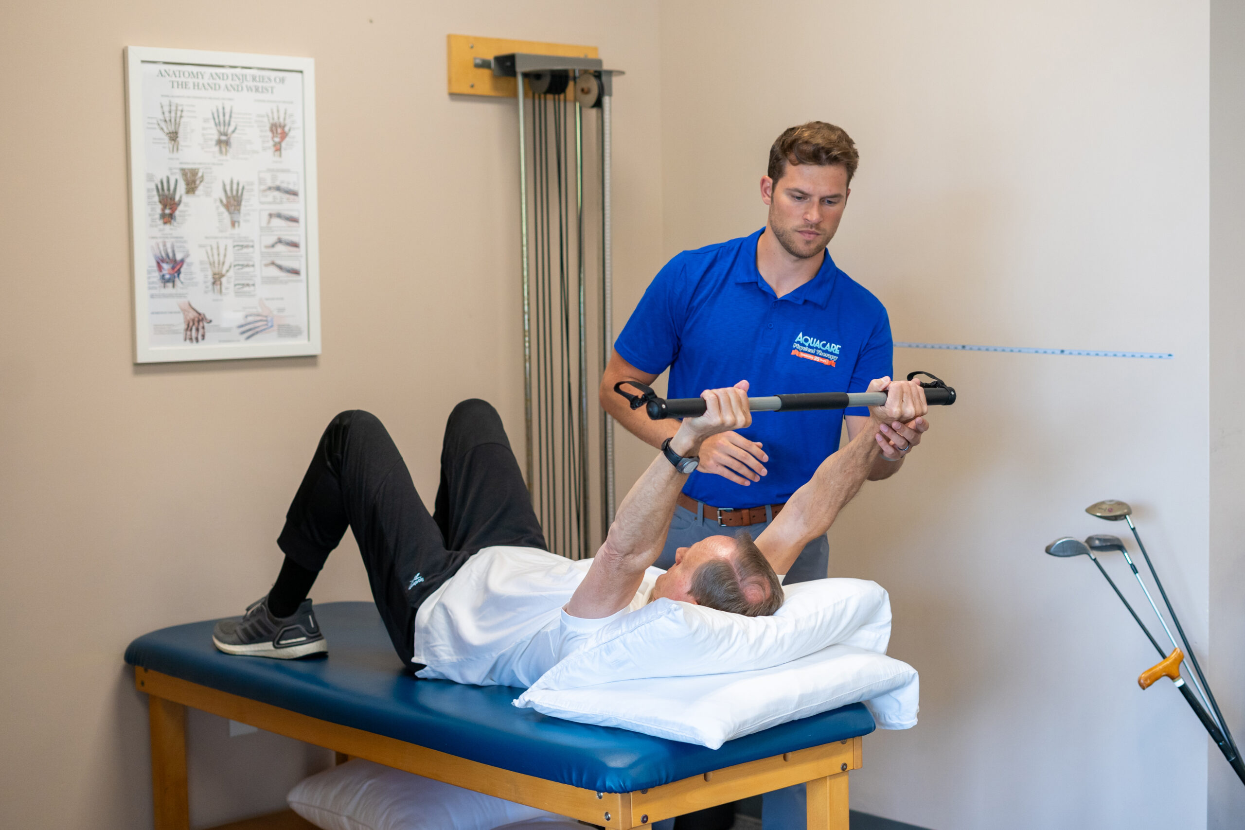a man is doing exercises on the back of another man