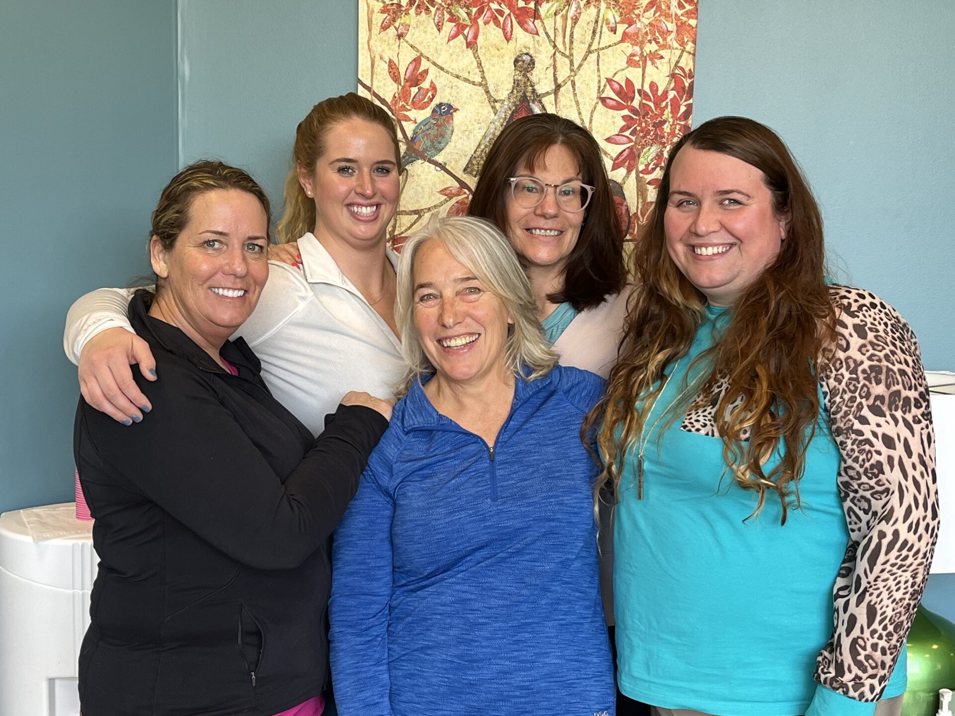 a group of women standing next to each other