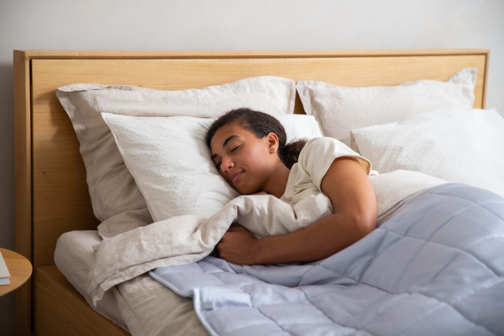 a young girl is sleeping in her bed