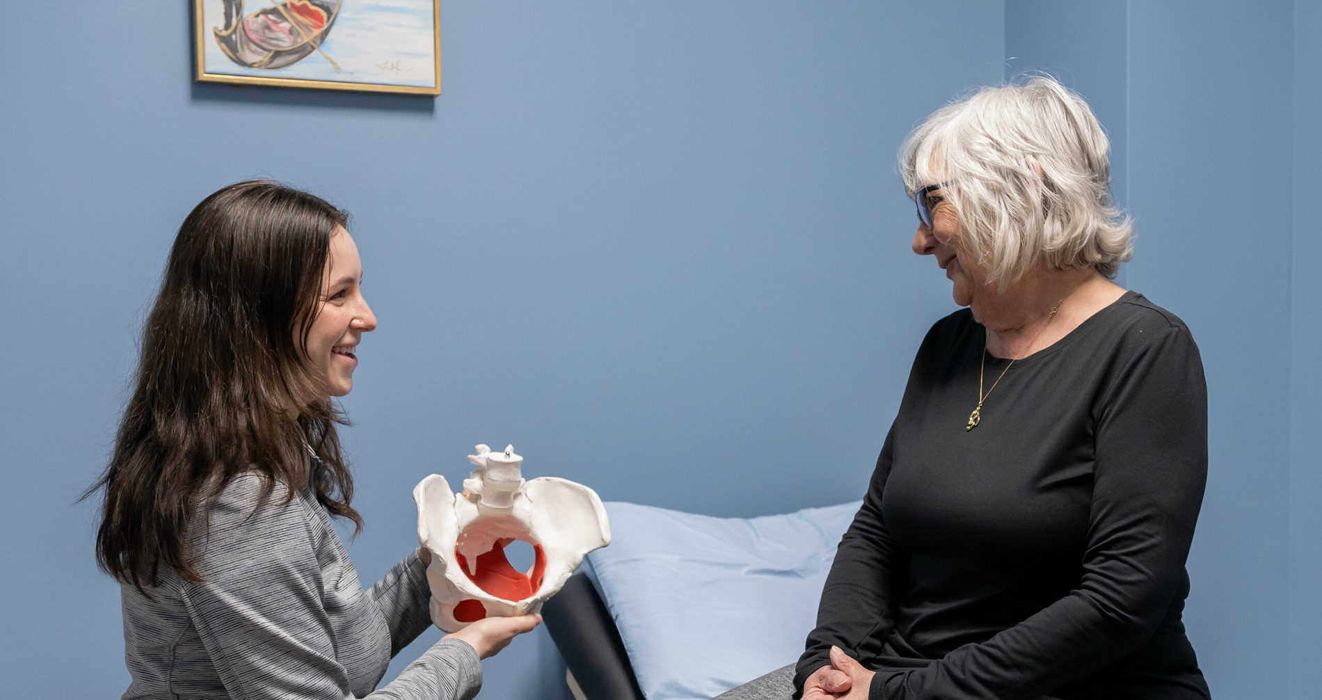 two women talking to each other in a room