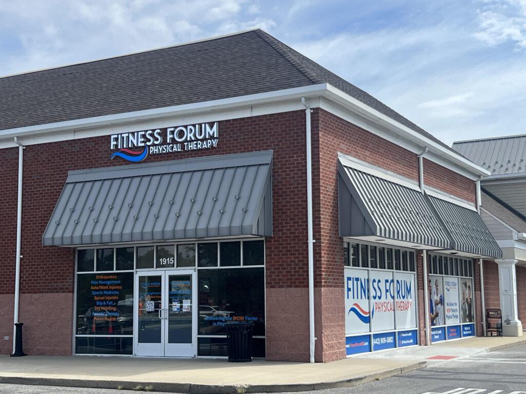 the front of a business with a sign that says fitness forum