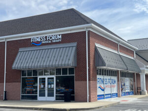 the front of a business with a sign that says fitness forum