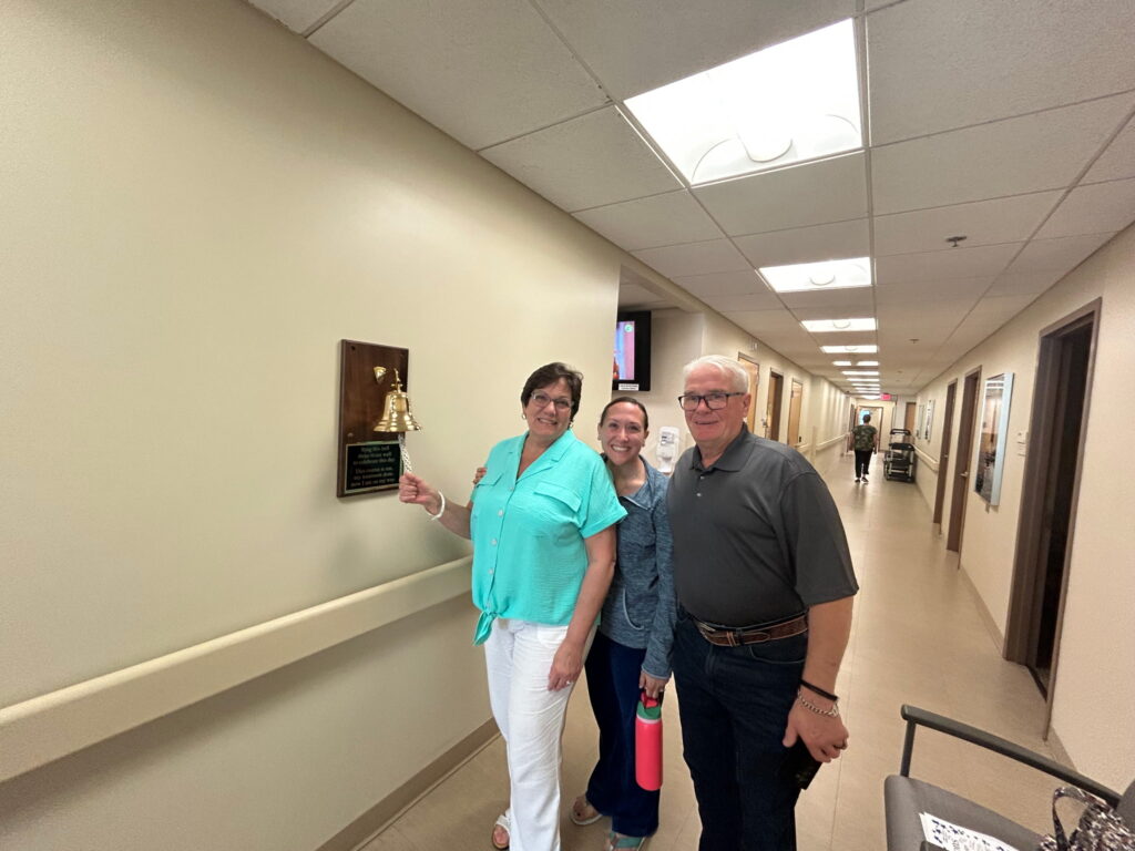 a group of people standing in a hallway