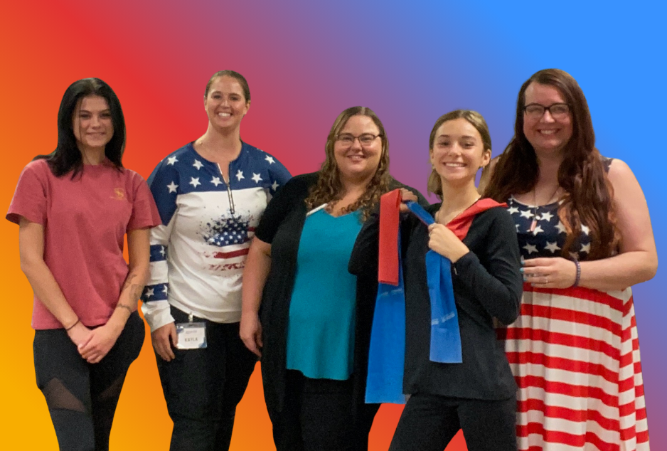 a group of women standing next to each other