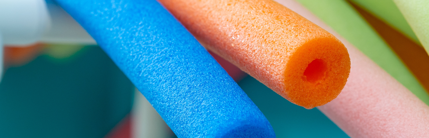 a close up of three different colored sponges
