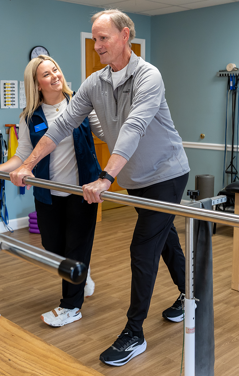 physical therapist working with patient