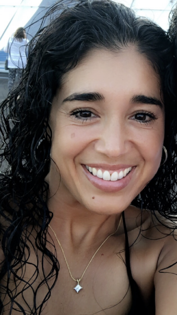 two women are smiling and posing for the camera