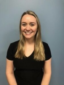 Headshot of a young adult female in a black shirt