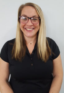 Headshot of a young adult female in black shirt