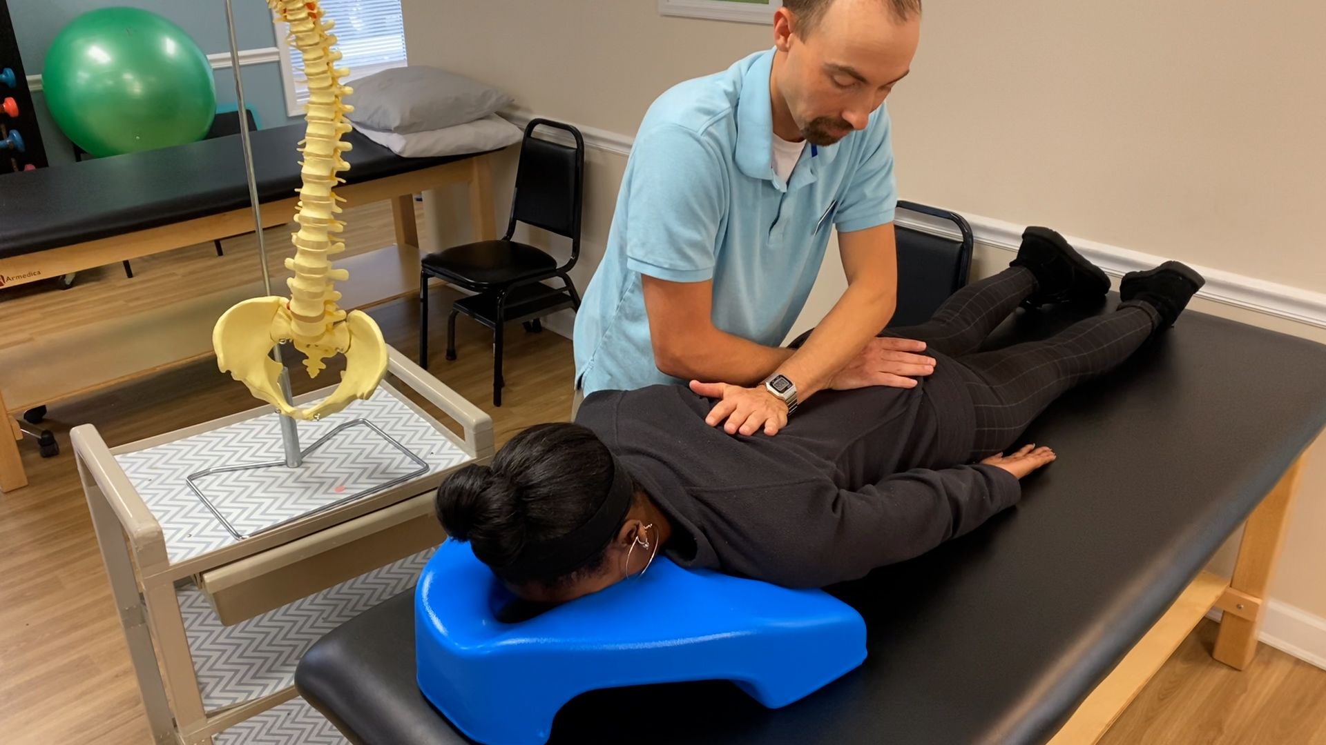 a man getting a back massage from a woman