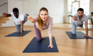 a group of people doing yoga on mats