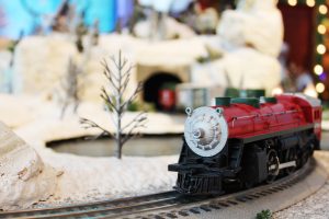 giving tuesday campaign and toy drive close up of train on track with wintery scene