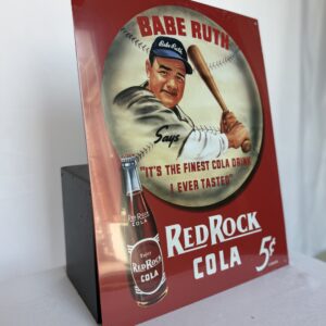 a red rock cola sign with a baseball player holding a bat
