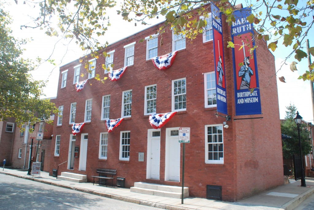 a red brick building with american flags on it