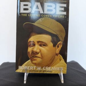 a book with a picture of a man wearing a hat