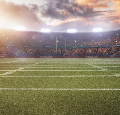 a football field with a stadium full of people