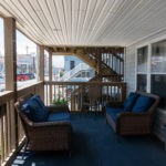 covered front porch with sofa seating