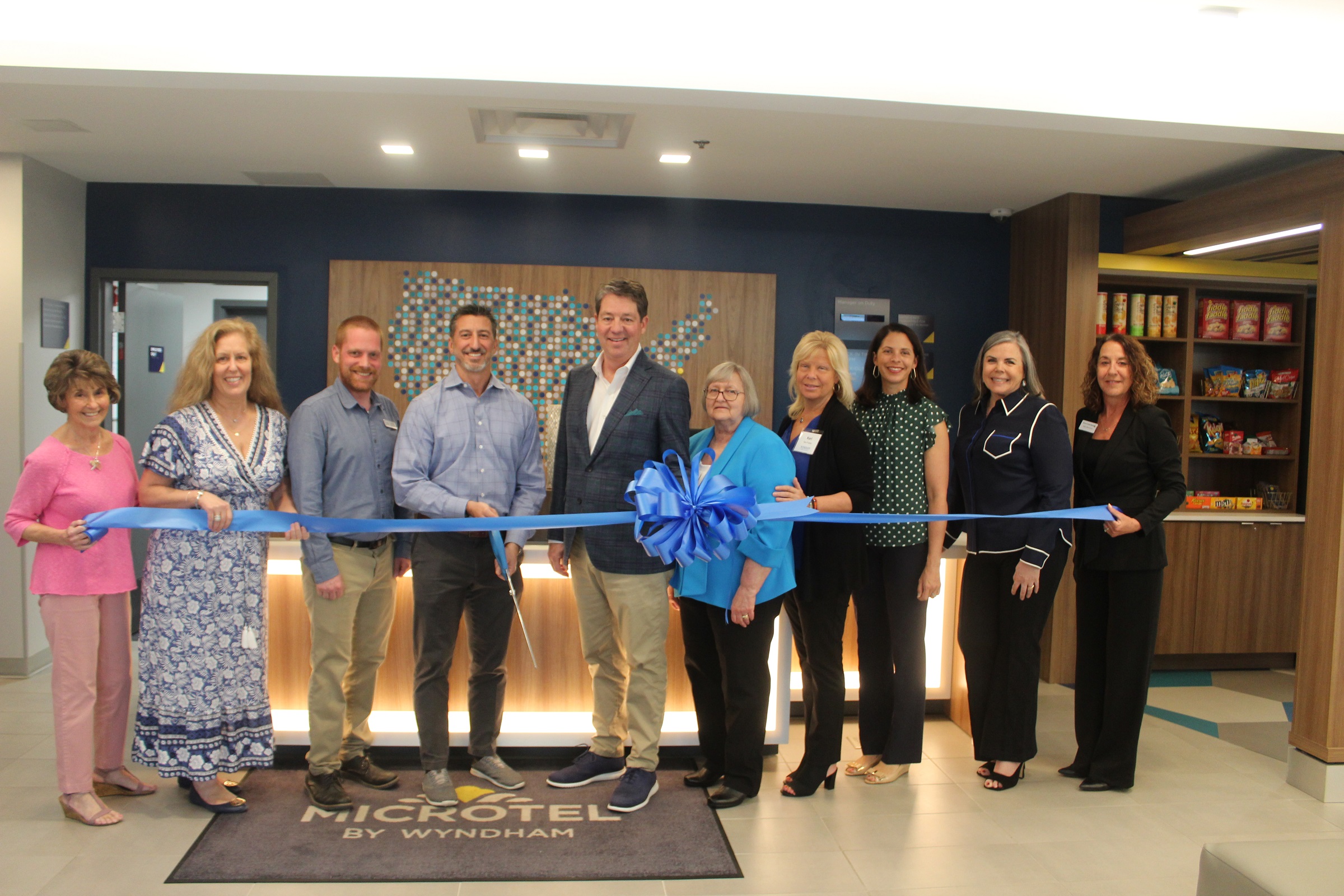 Beacon Hospitality employees lined up for the ribbon cutting ceremony