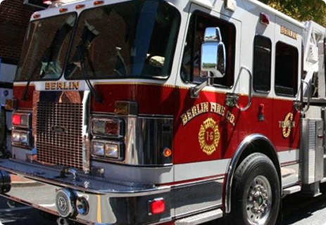 a fire truck parked on the side of the road