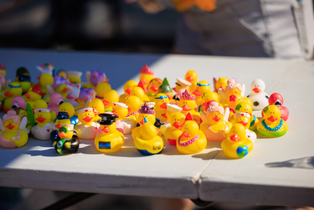a bunch of rubber ducks sitting on a table