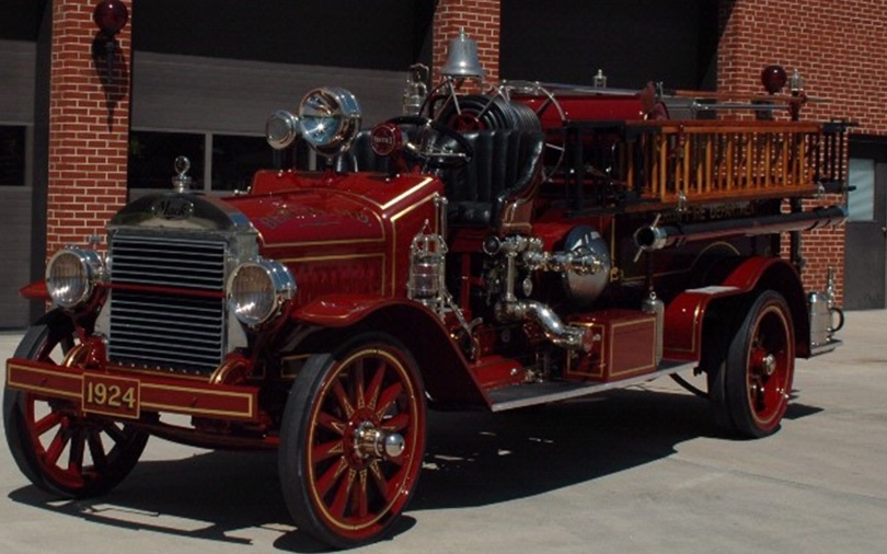 a red fire truck parked in front of a building
