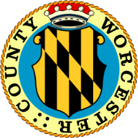 a black and yellow emblem with a crown on top of it
