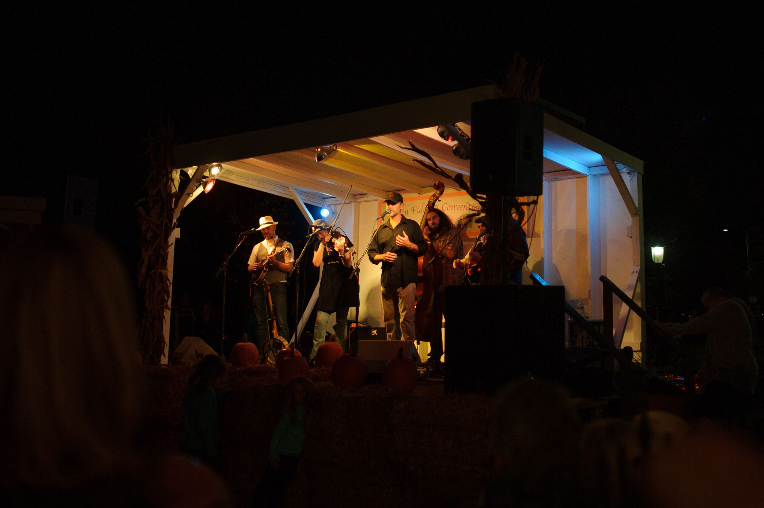 a group of people standing on top of a stage