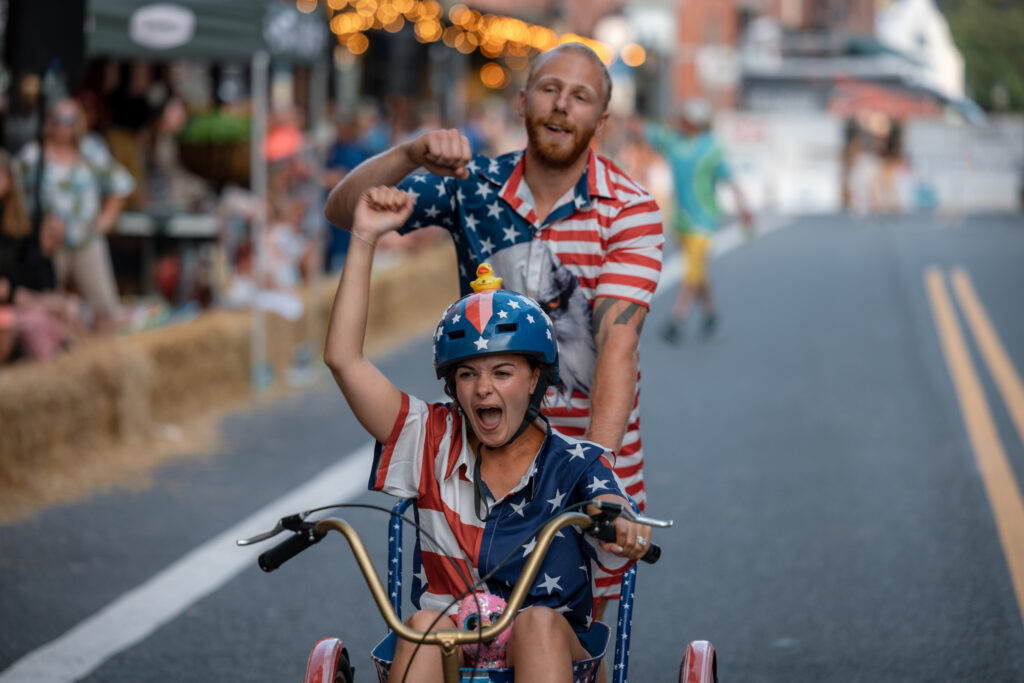 A team in American Flag clothes fisting bumping the air