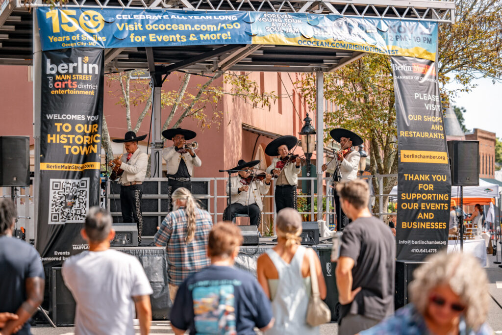 a group of people standing on top of a stage