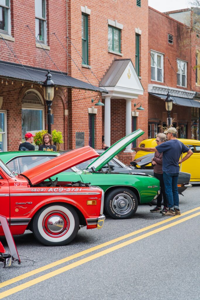 a group of cars parked on the side of a road