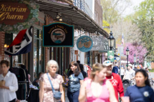 a group of people walking in downtown Berlin, Maryland