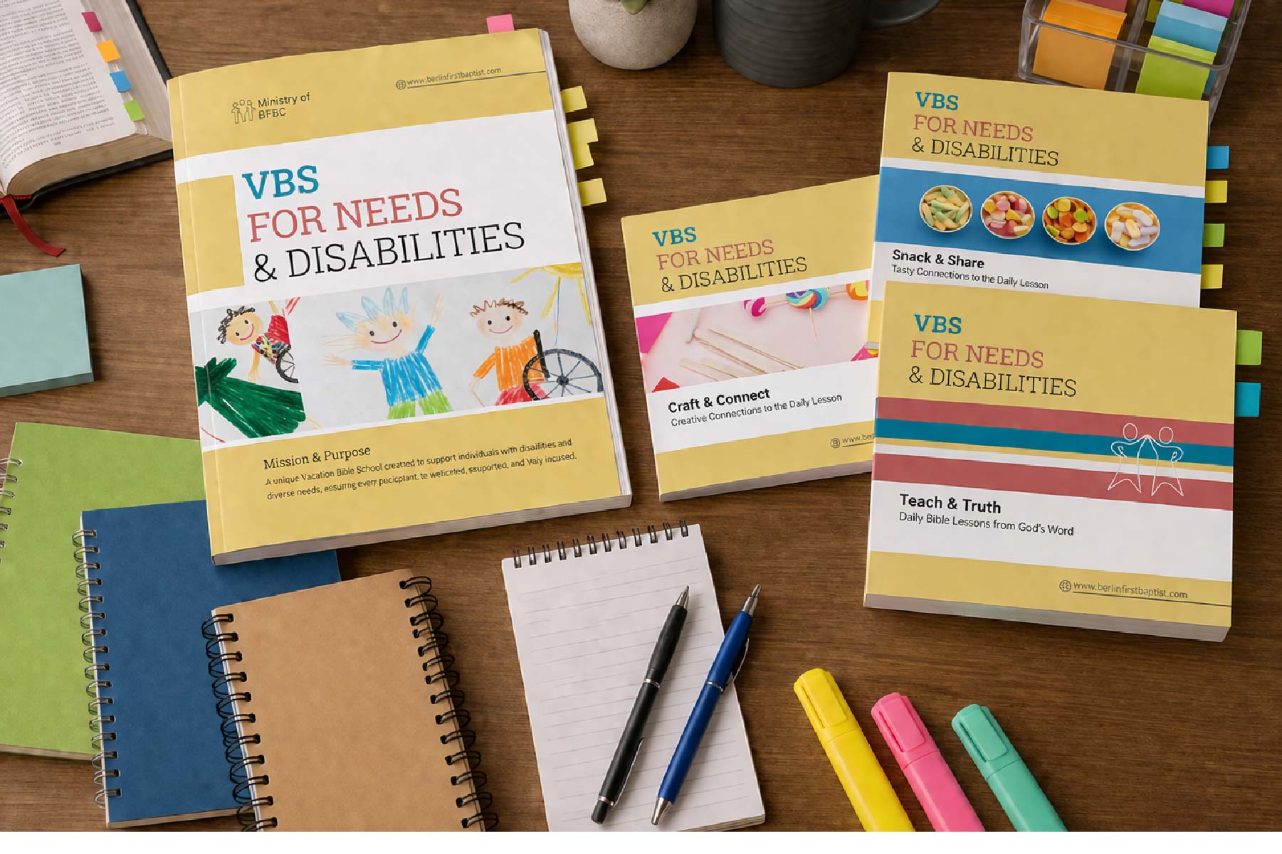 a wooden table topped with notebooks and papers