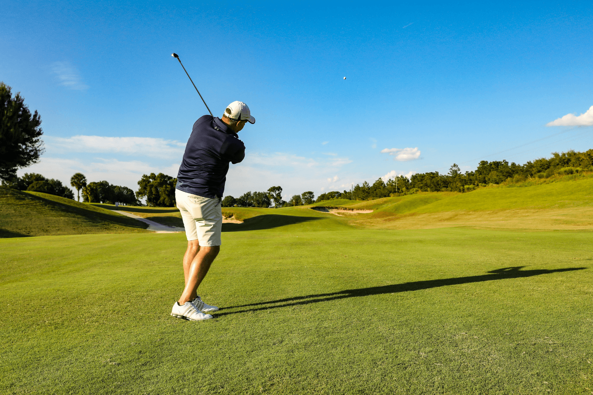 man swinging a golf club