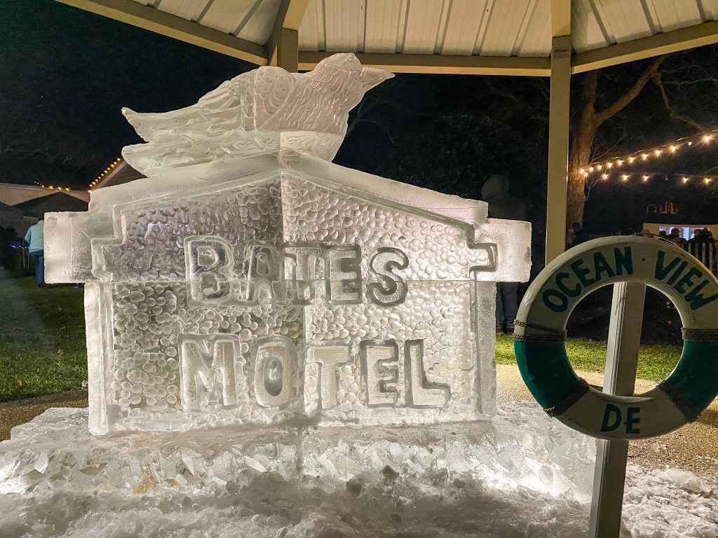 an ice sculpture of a woman on top of a building