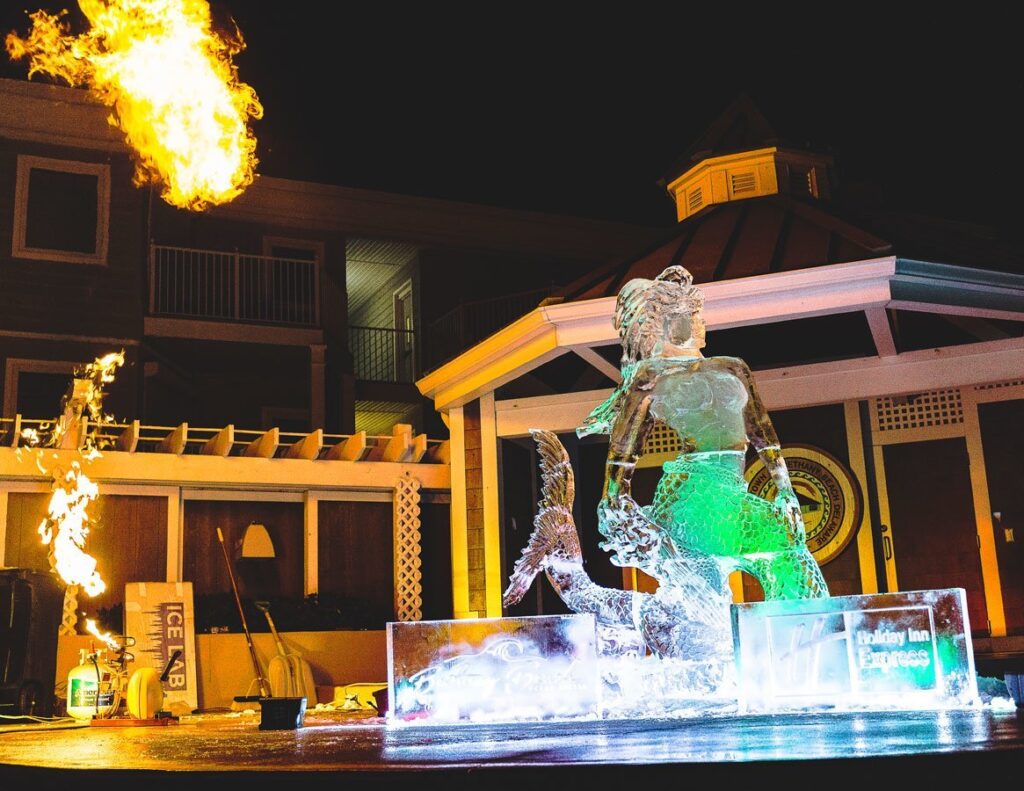 a fire and water fountain in front of a building
