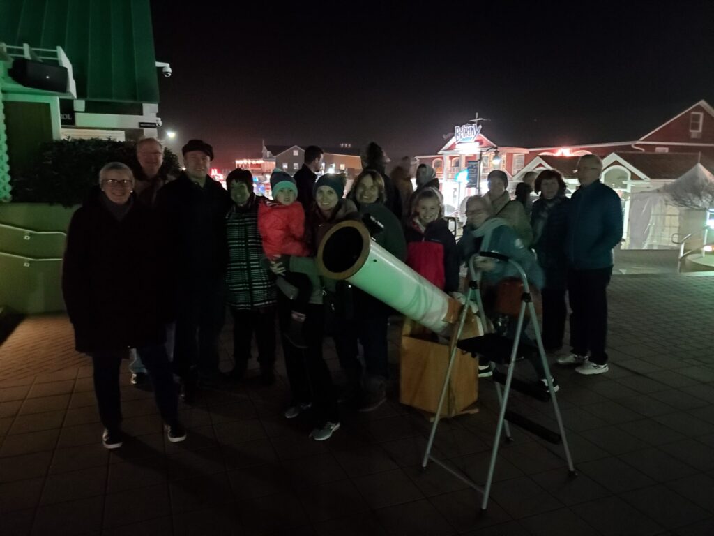 a group of people standing next to each other