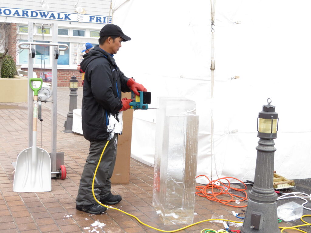 a man standing next to a box and a street light