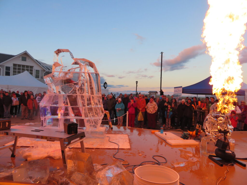 a group of people standing around a fire pit