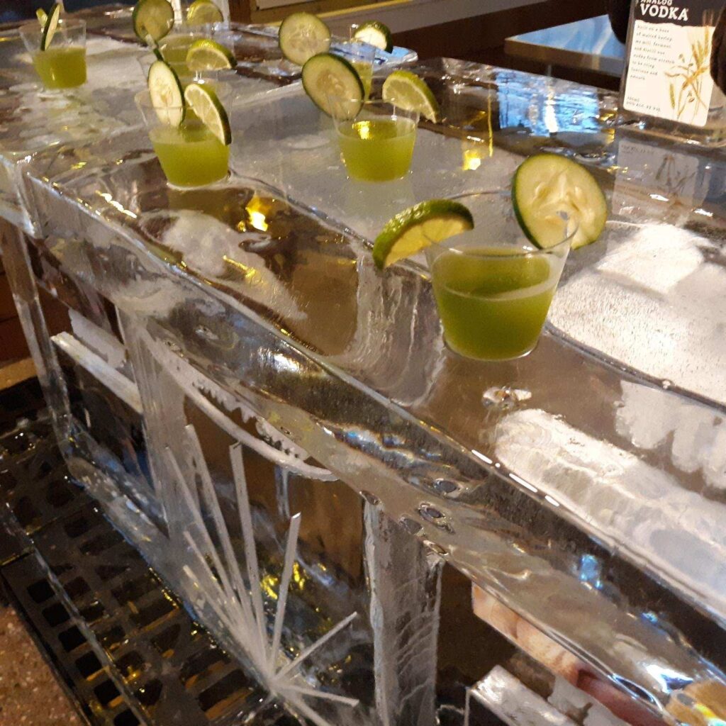 a bunch of drinks that are sitting on some ice