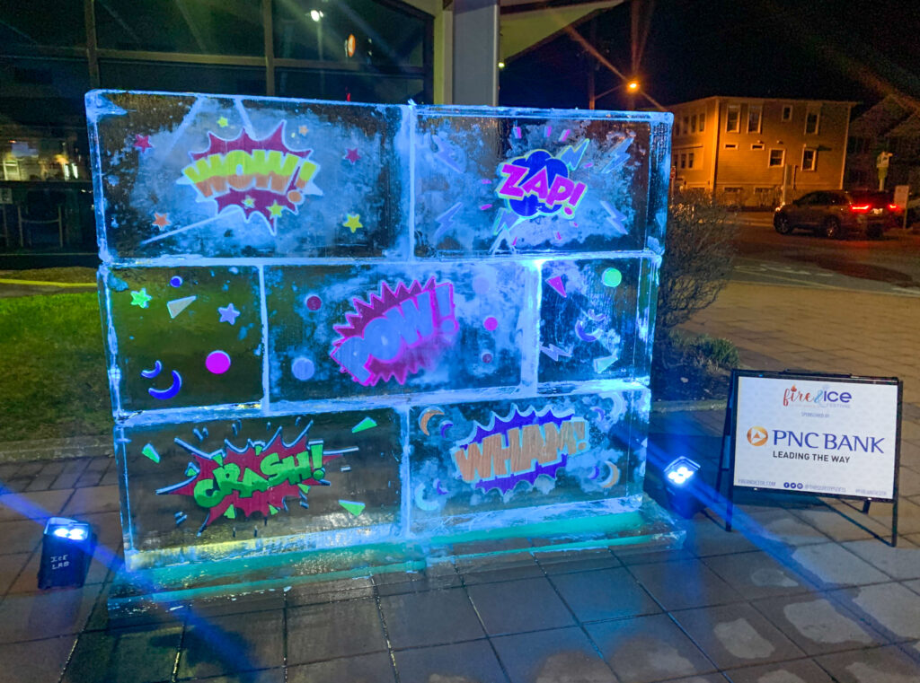 a display of neon colored graffiti on a sidewalk