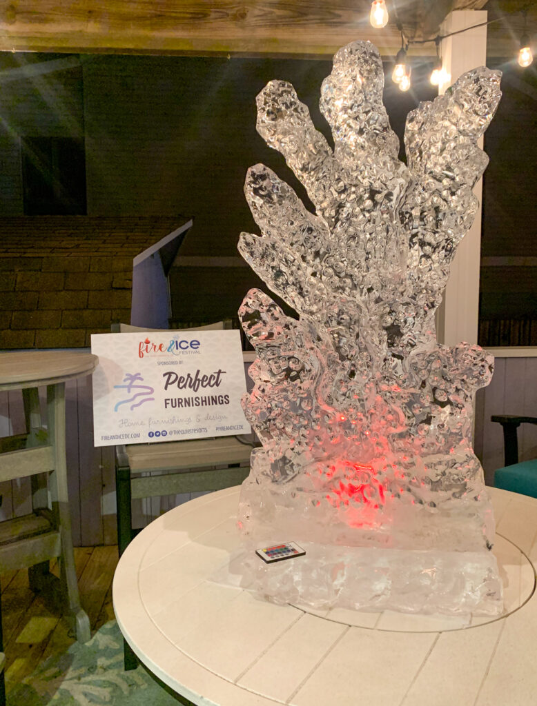 a table with a large ice sculpture on top of it