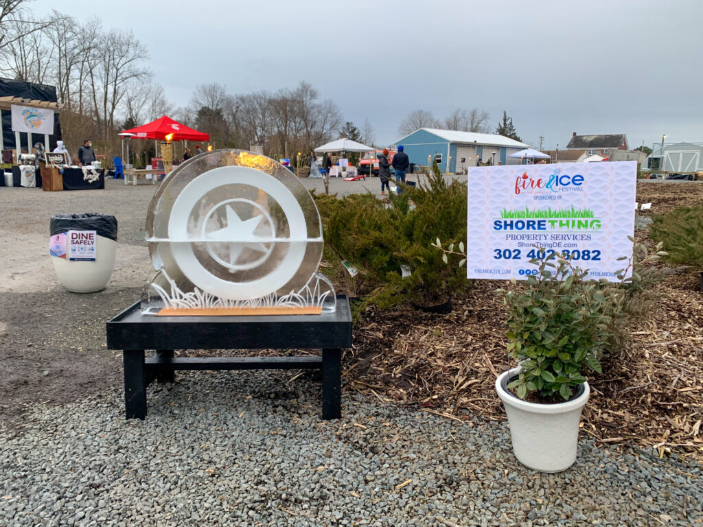 a sign that is sitting in the gravel