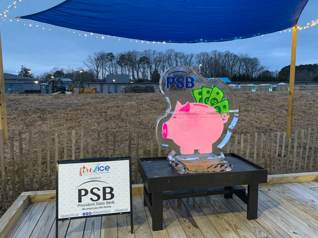 a sculpture of a pig on a wooden platform