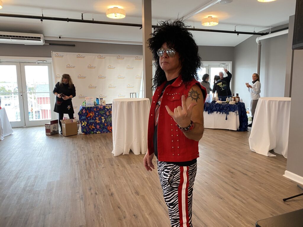 a man in a red shirt and zebra print pants