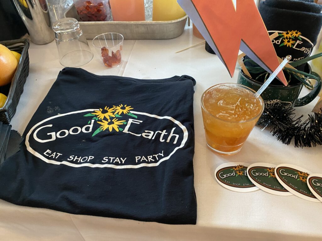 a table topped with fruit and a t - shirt